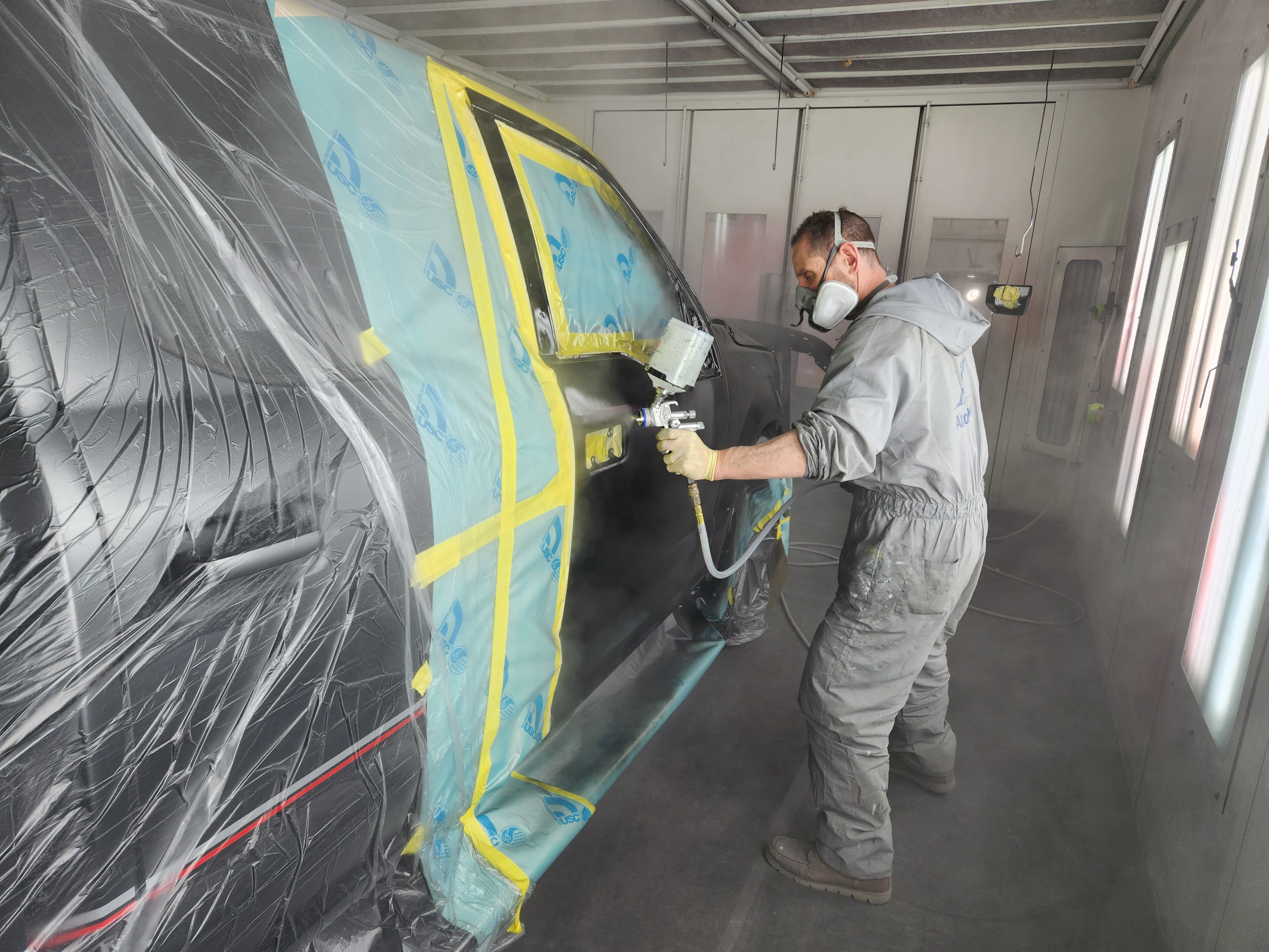 Worker Painting Car